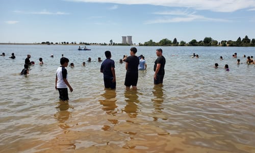 Kids playing in the water at the beach