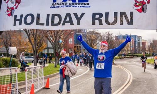 A runner crossing the finish line.