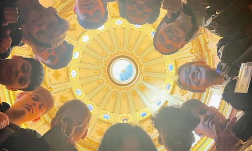 Child being helped with bicycle