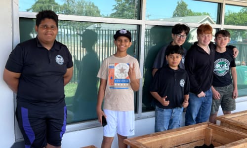 Child being helped with bicycle